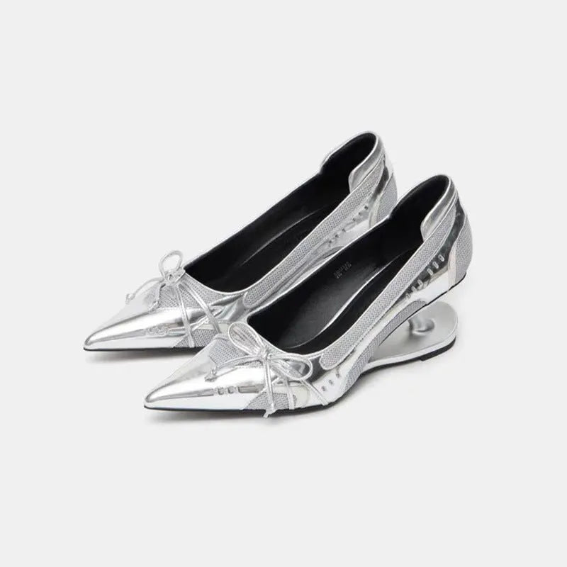 Women's black pointed toe shoes with a distinctive floating Mary Jane heel.