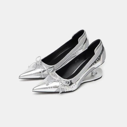 Women's black pointed toe shoes with a distinctive floating Mary Jane heel.