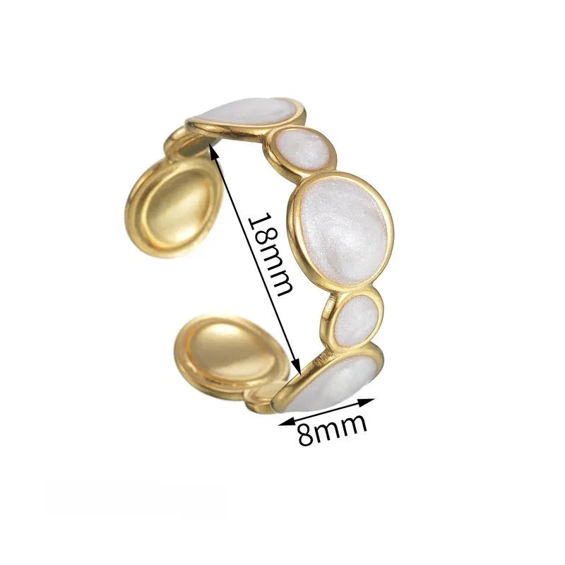 Adjustable geometric stainless steel ring showing angular design and opening mechanism