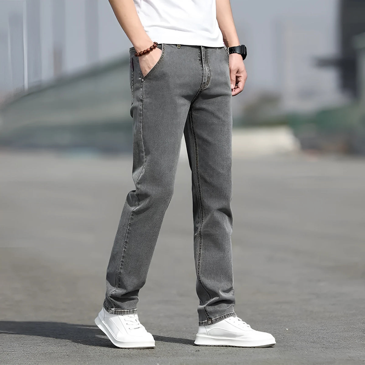 Men's smoky gray straight leg jeans with high elasticity fabric and low waist design