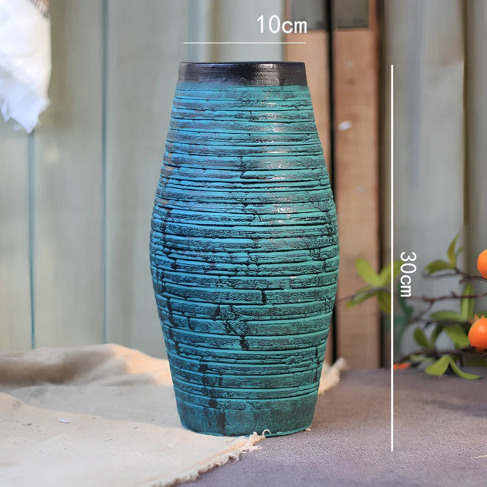 Ceramic mosaic vase with dried flower arrangement, handcrafted surface detailing