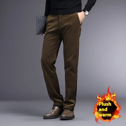 Man wearing khaki and black striped straight-leg retro trousers with a zip fly.