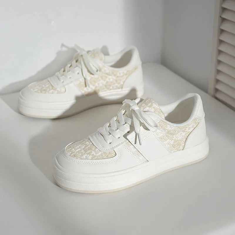 Beige and plaid patterned platform sports shoes with round toe and white rubber sole.