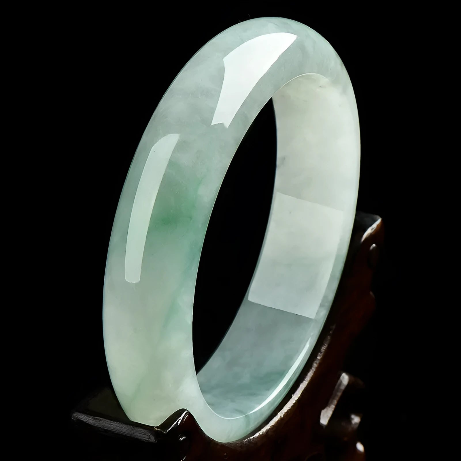 Light green jade stone bracelet showing natural mineral texture on wrist