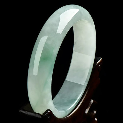 Light green jade stone bracelet showing natural mineral texture on wrist