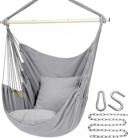 Folding outdoor tassel hammock in beige with canvas seat, cushion, and three-section iron pipe