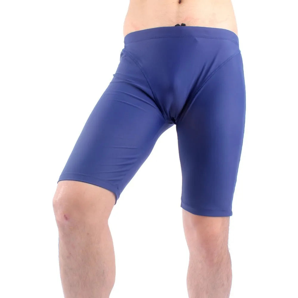 Men's green and navy blue quick-dry swimming trunks with loose fit and anti-embarrassment design