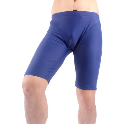 Men's green and navy blue quick-dry swimming trunks with loose fit and anti-embarrassment design