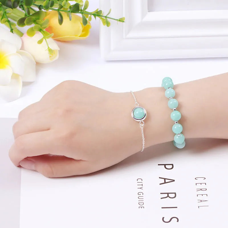 Double-layer women's bracelet with lucky beads and colourful crystals in gold-toned setting