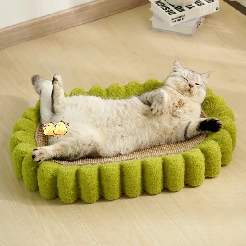 Green oval-shaped sisal cat scratching pad with a deep centre bowl for use as a cat bed.