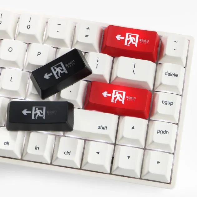 Keyboard key cap with safety evacuation exit symbol design for personalisation, transparent cap fits mechanical keyboards, available in red or black colour options with backspace or enter key style options for custom keyboard builds