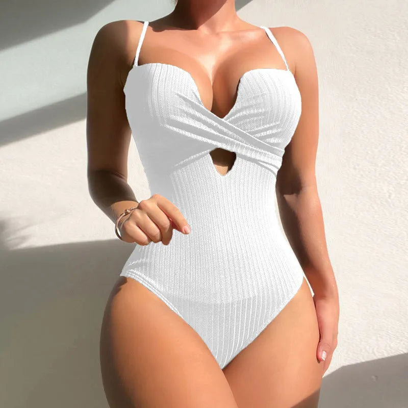 Women's solid colour slim fit one-piece swimsuit in polyester fabric.