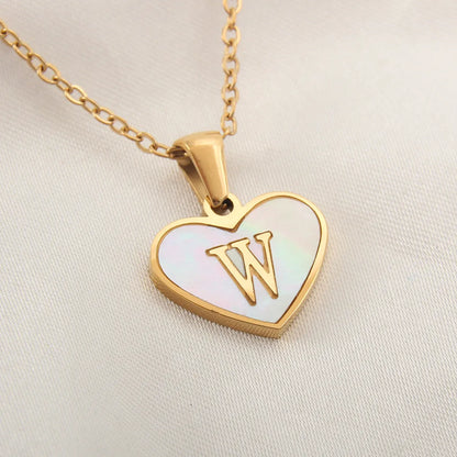 Gold-plated heart necklace with white shell pendant showing letter personalisation option