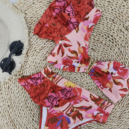 Women's one-shoulder ruffled high-waist bikini with pink background and red flower pattern