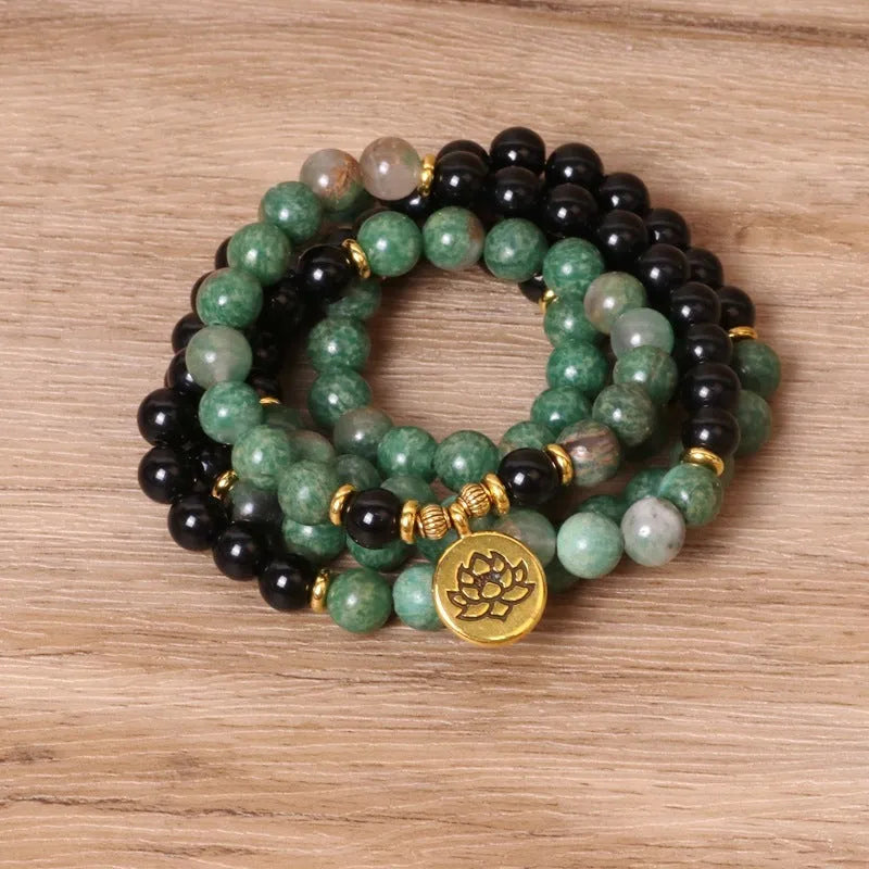 Elastic beaded long bracelet for women in green and black alloy with natural style design, an adjustable fashion bracelet with elastic string construction for easy wear and contemporary accessory styling