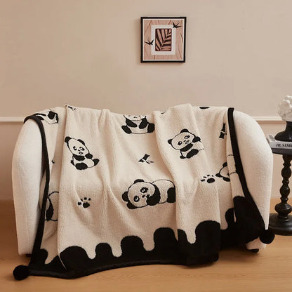 Black and white cationic panda pattern velvet blanket showing texture and modern design