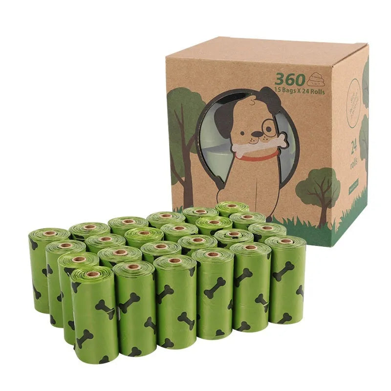 Roll of military green degradable dog poop bags with black bone print, shown next to a plastic dispenser.