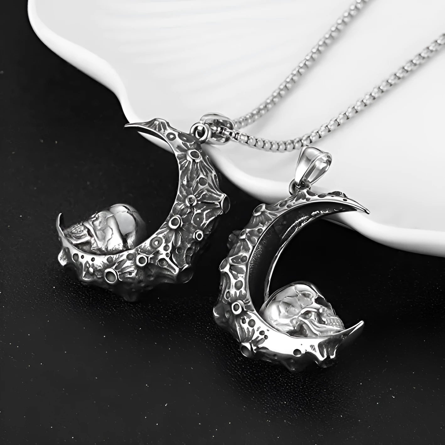 Men's silver electroplated skull necklace with stainless steel chain and alloy pendant showing six design options