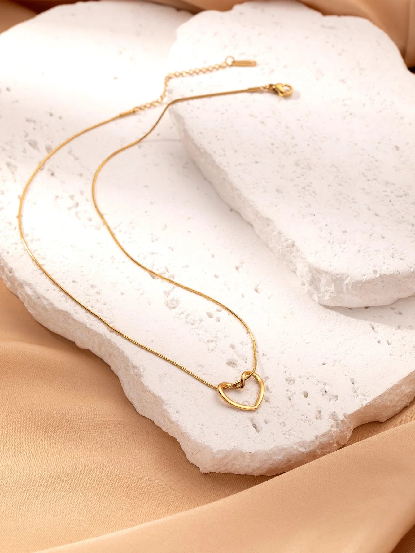 Elegant titanium steel heart pendant necklace with adjustable chain in gold and silver colors