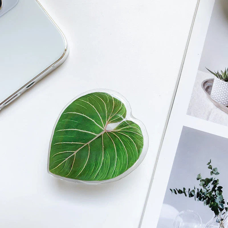 Stylish smartphone stand with leaf-inspired design for secure hands-free support and mobile device versatility