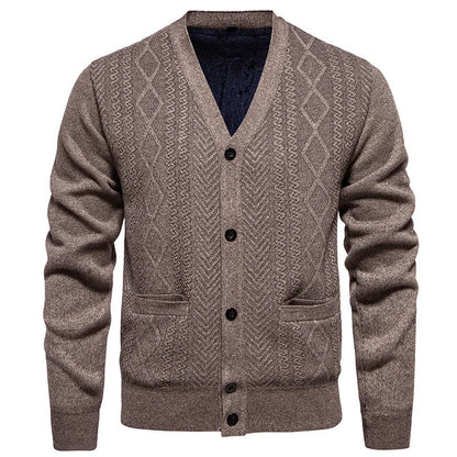 Man wearing a brown striped wool-lined cardigan sweater, showing the open front and long sleeves.