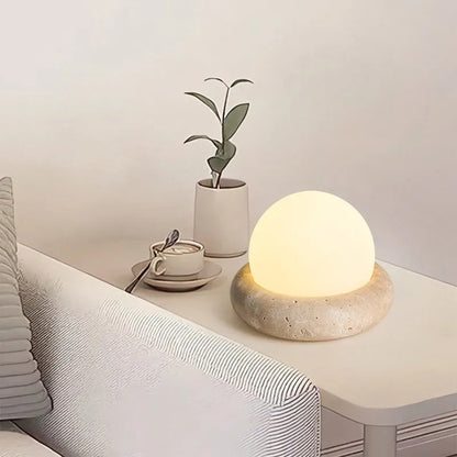 Cream coloured bedside night lamp with remote control measuring 15.5cm diameter