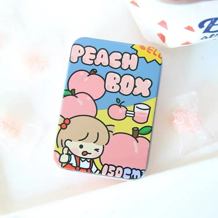 Small white iron storage box with a printed apple girl design on the lid.