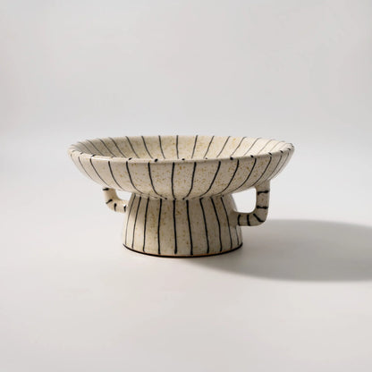 Black and white striped synthetic resin fruit plate with retro fruit motifs, 20cm diameter