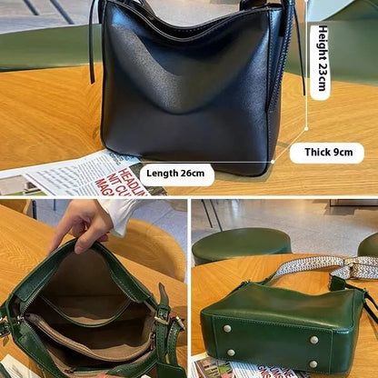 Women's black genuine leather shoulder messenger bag showing structured square shape and single strap.