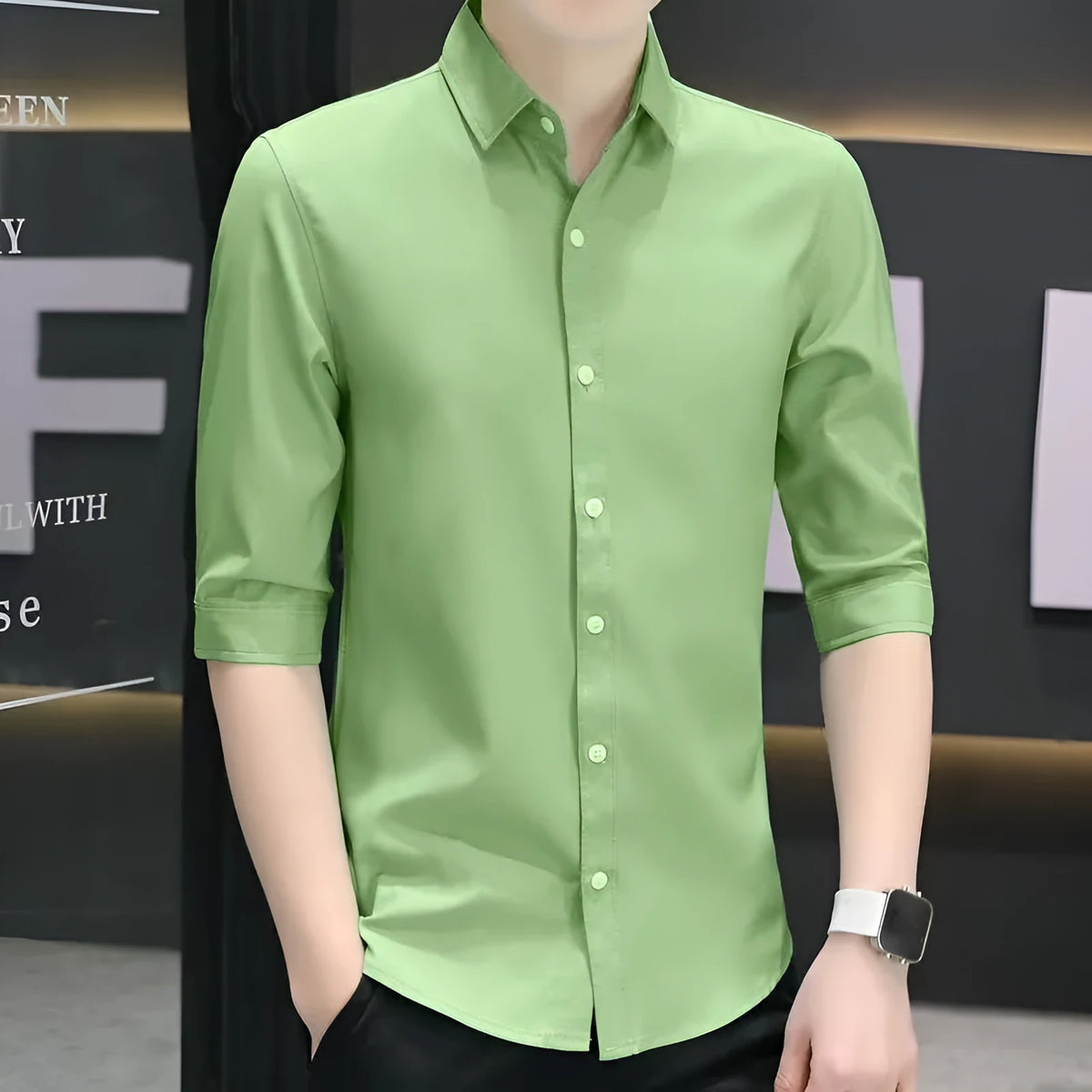 Man wearing a light blue linen-silk blend half-sleeve shirt with 3/4 sleeves in a loose slim-fit.