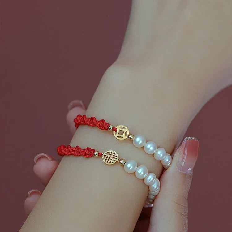 Women's pearl bracelet with braided red rope and geometric fu character charm