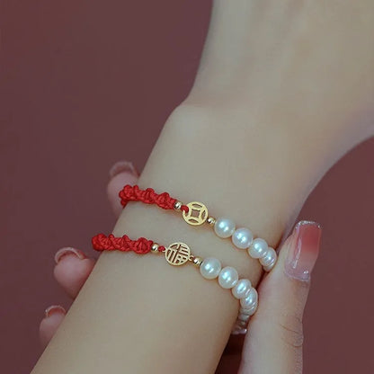 Women's pearl bracelet with braided red rope and geometric fu character charm