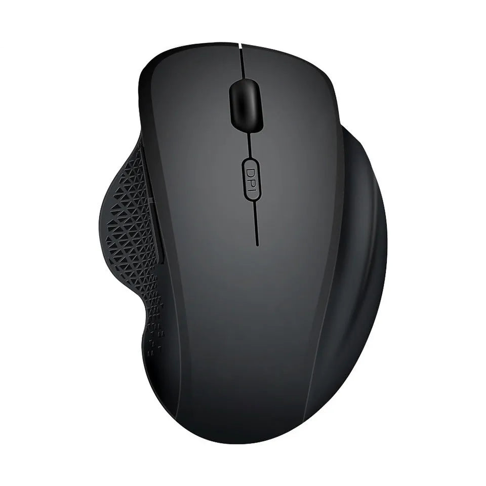 Grey and black wireless notebook mouse with USB charging cable on a laptop keyboard