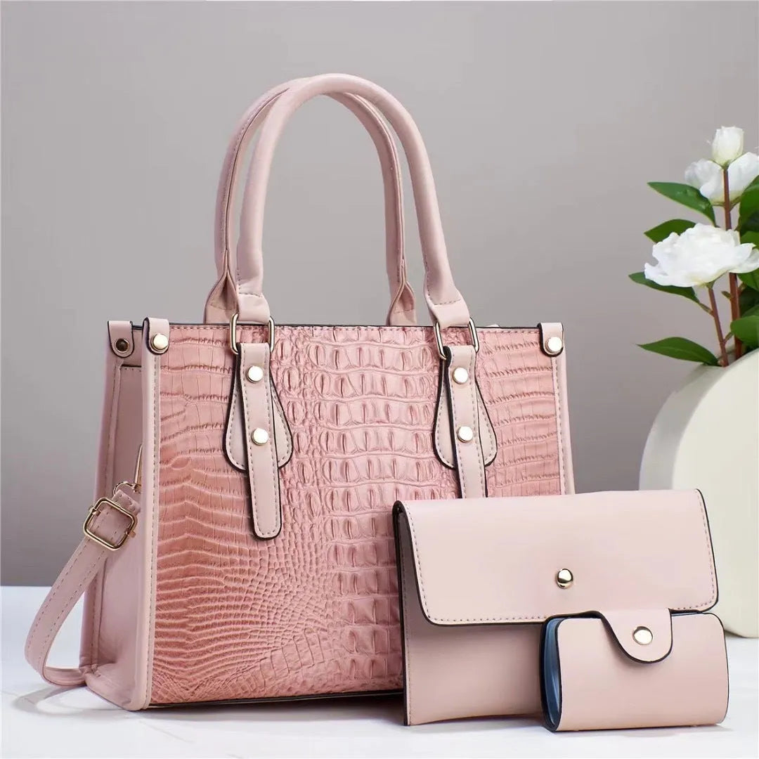 Contrast colour three-piece bag set showing bucket-shaped crossbody bag, wallet, and card holder in coordinated colours