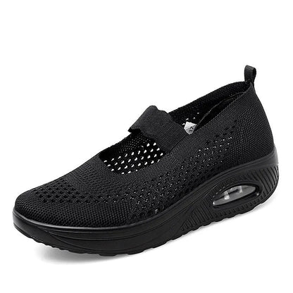 Women's black mesh slip-on casual shoes with round toe and low heel on white background