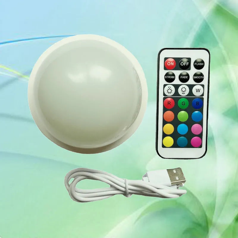 Colourful gradient 3D shooting light with remote control and touch activation on black background