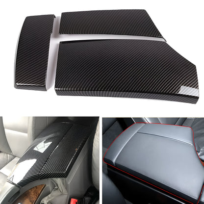 Set of three black ABS armrest box covers with a diagonal carbon fibre weave pattern and polished surface.