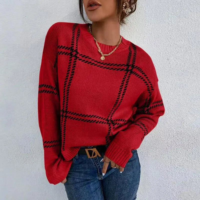 Women's loose-fitting plaid crew neck sweater with apricot, black, beige, red, and green colour-block stripes.