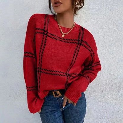 Women's loose-fitting plaid crew neck sweater with apricot, black, beige, red, and green colour-block stripes.