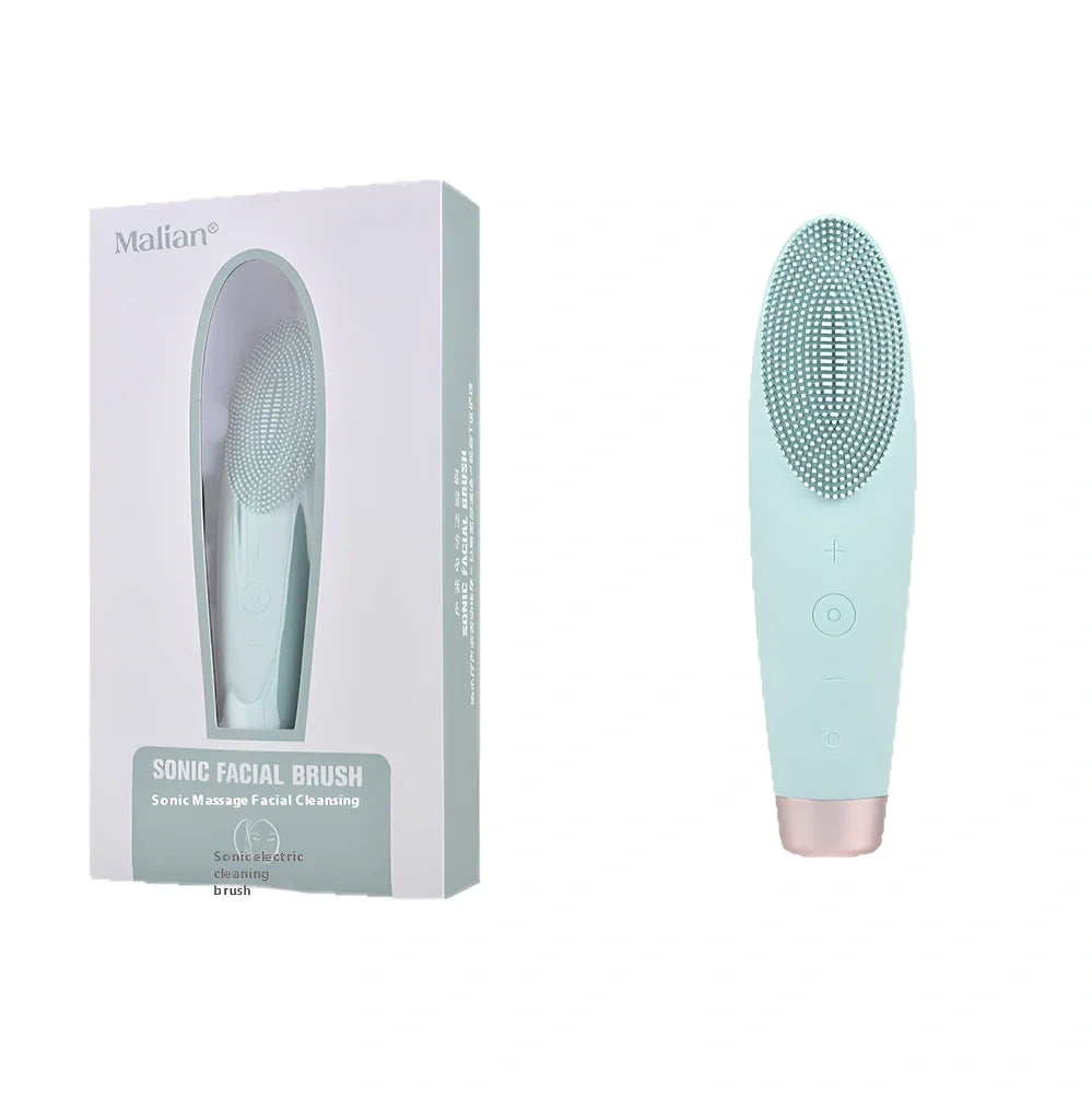 Green electric facial cleaner with silicone brush head, measuring 15cm length