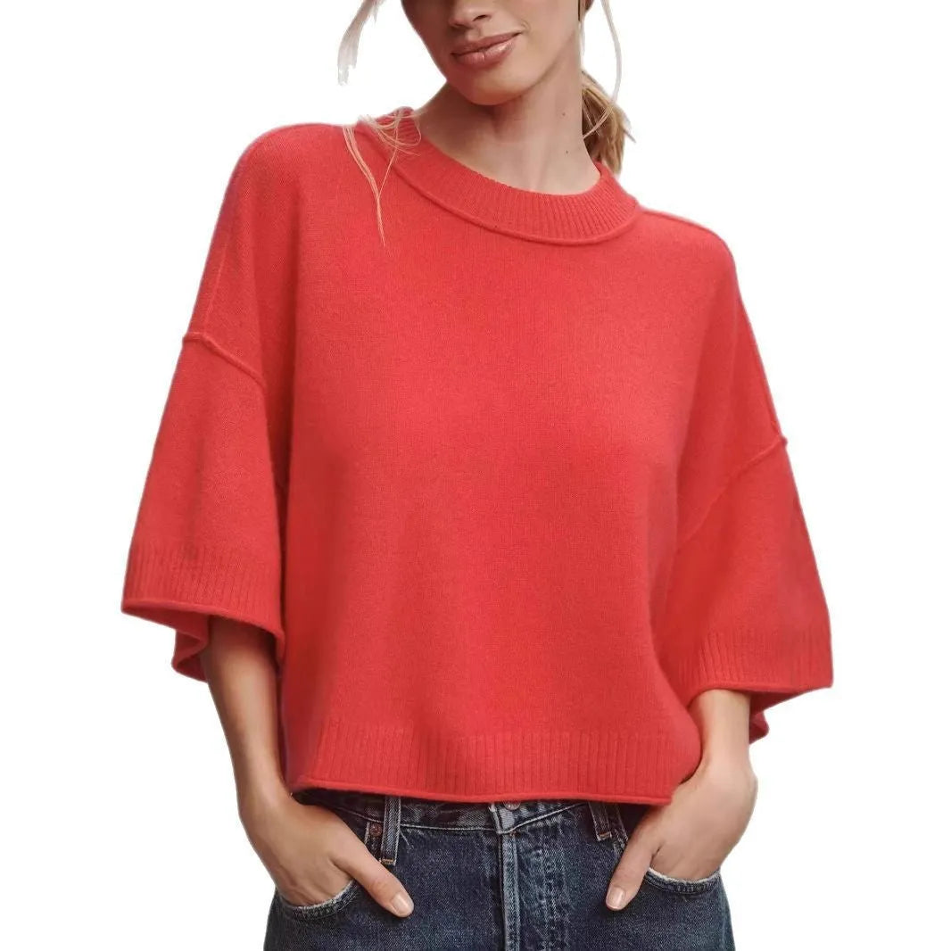 Women's red short sleeve viscose T-shirt with an exposed navel cropped design on a model.