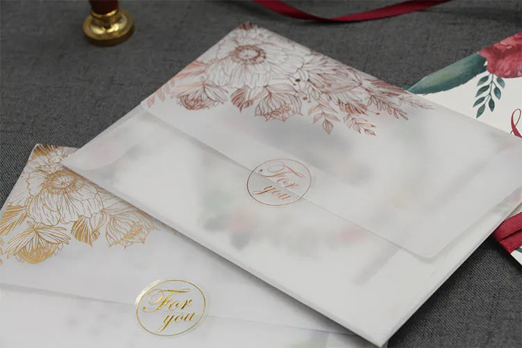 Sulfuric acid paper invitation card with bronzing matte varnish finish in gold or rose gold colour options, measuring 12.5cm by 17.6cm with included stickers for gift envelope use