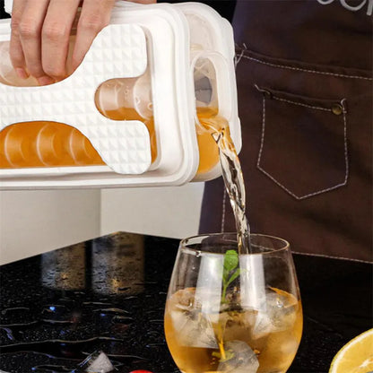 Light grey silicone ice ball mould and water bottle with lid on a kitchen counter.