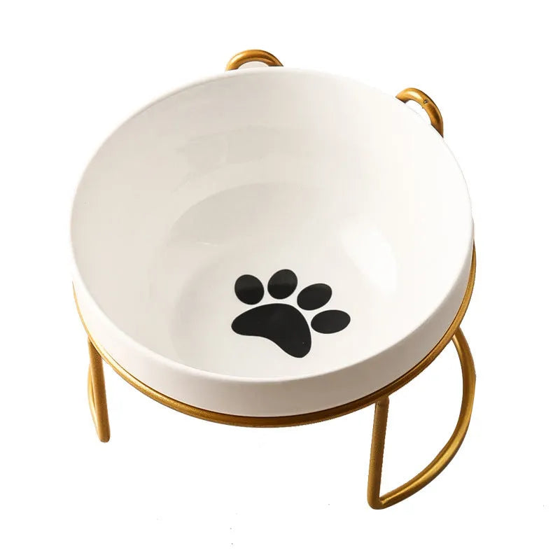 White ceramic pet bowl with cat paw print in a black iron stand with cat ear details