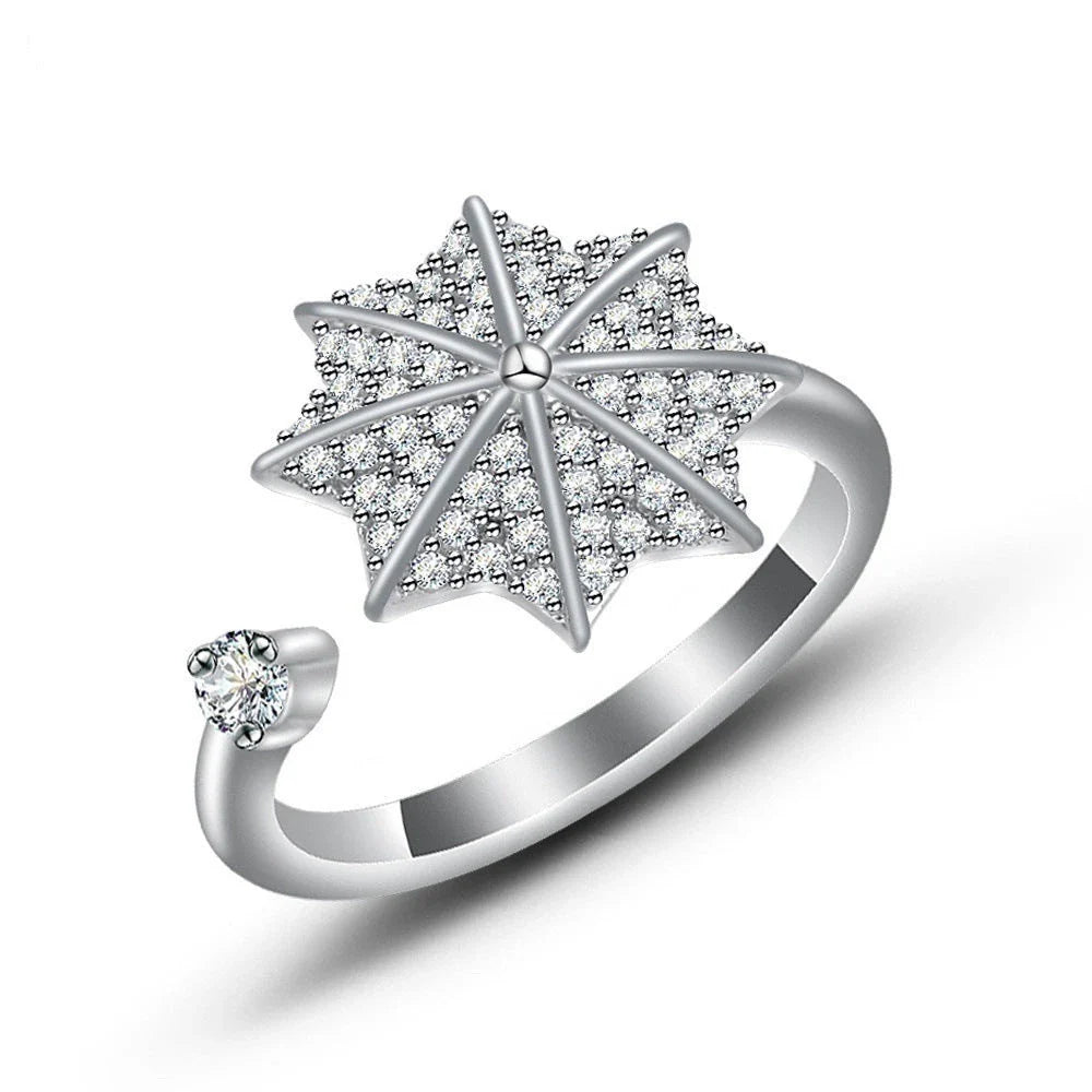 Adjustable spinner ring with rotating floral, geometric, and nature-inspired motifs for women's fashion and stress relief