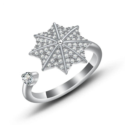 Adjustable spinner ring with rotating floral, geometric, and nature-inspired motifs for women's fashion and stress relief