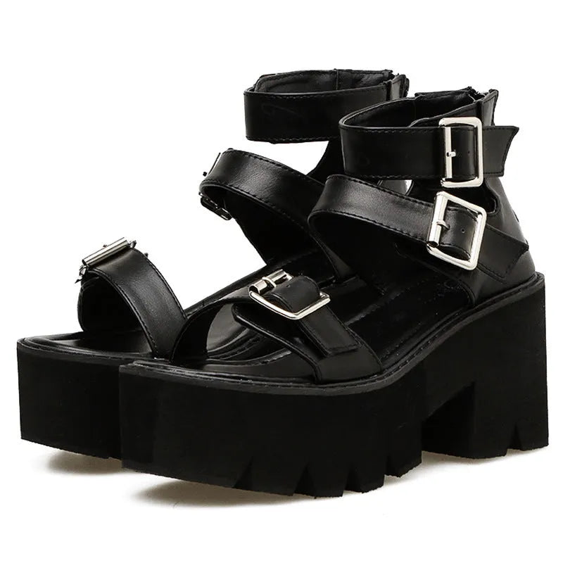 Black punk-style women's sandals with a chunky heel, thick platform sole, round toe, buckle strap, and back zipper.