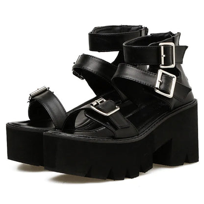 Black punk-style women's sandals with a chunky heel, thick platform sole, round toe, buckle strap, and back zipper.