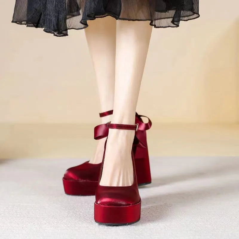 Women's waterproof wedding pumps with chunky heel in wine red colour featuring silk buckle detail