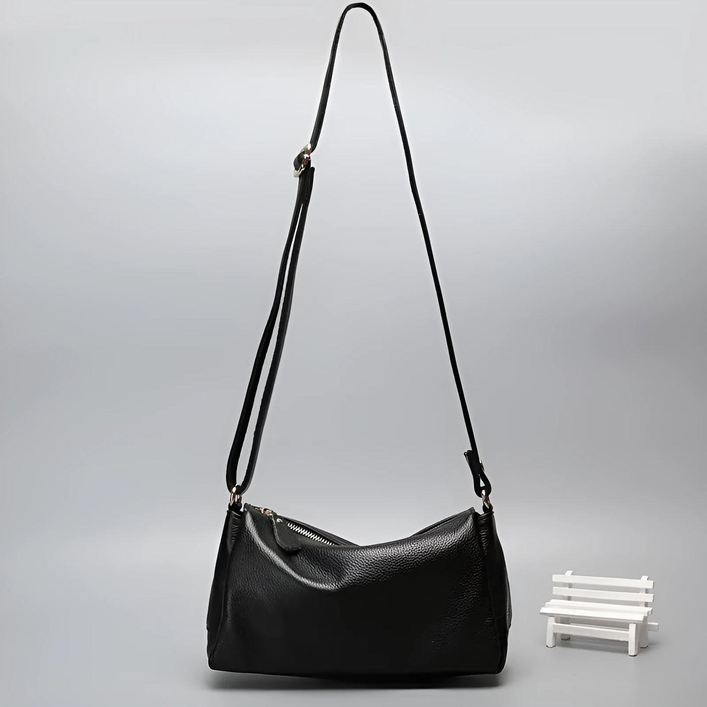Soft genuine cowhide leather women's crossbody bag in horizontal square shape on a single strap.